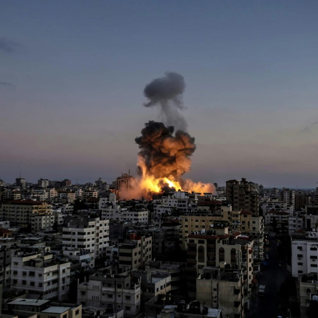 A large fire is burning in a city