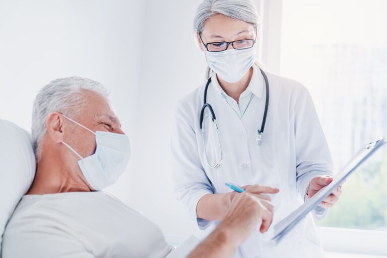 old man sitting on hospital bed ang signing medica 2022 06 21 17 45 44 utc 1 scaled 1 768x512