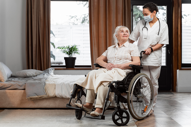 doctor talking with her elder patient 768x512