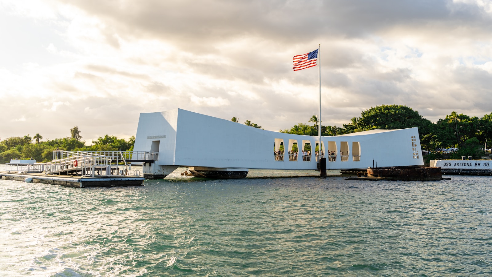 A large white building sitting on top of a body of water